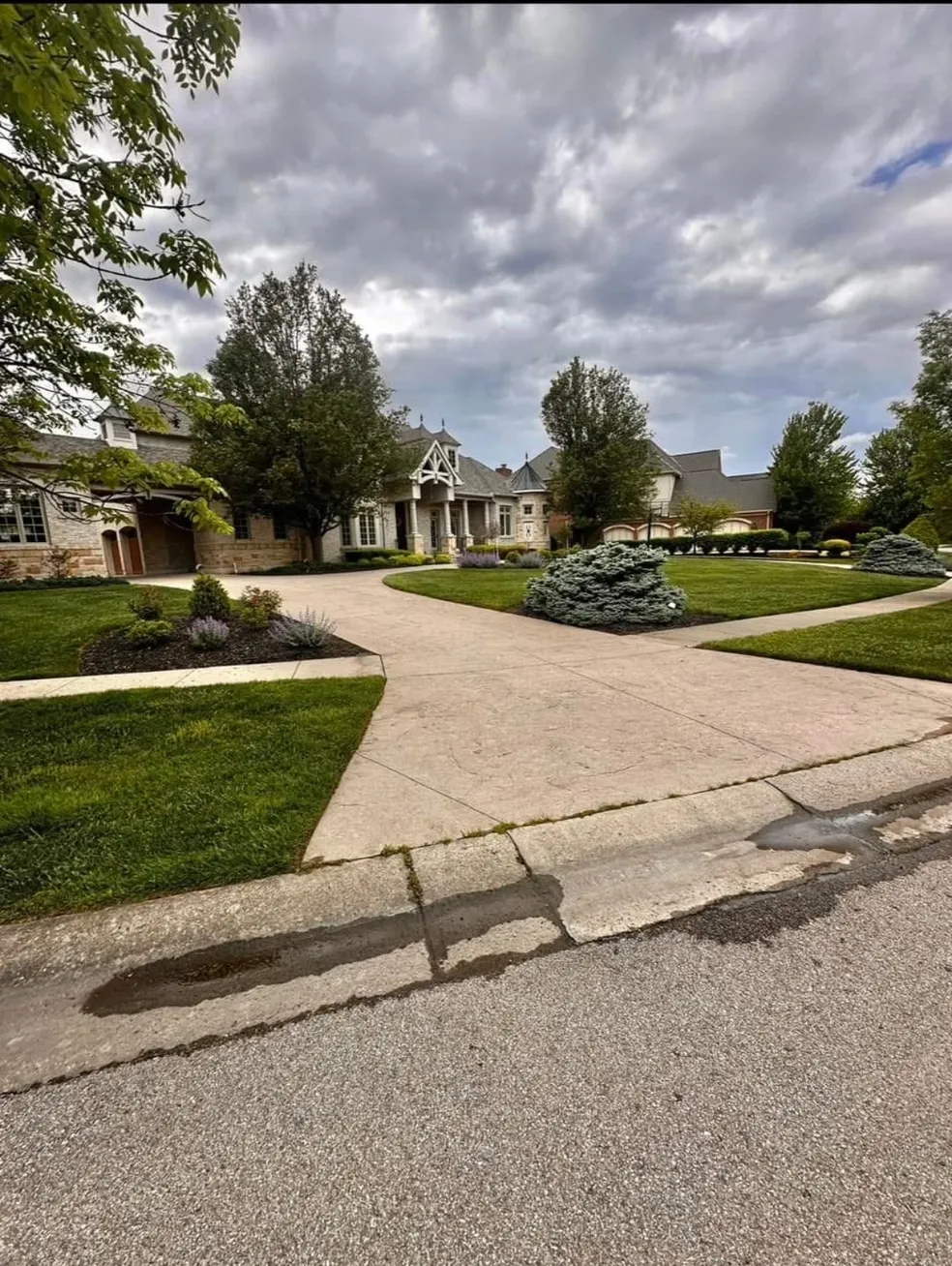 Elegant house with landscaped front yard.