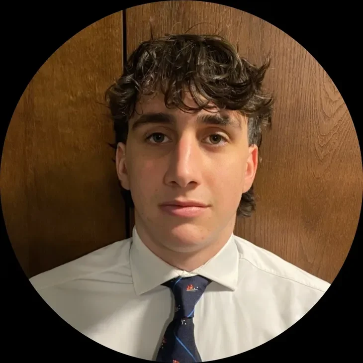 joe Young man wearing a white shirt, tie.